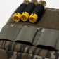 A close-up of a camouflage tactical pouch with a gray webbing strap, holding three shotgun shells with black foam grips and yellow brass bases, on a white background.